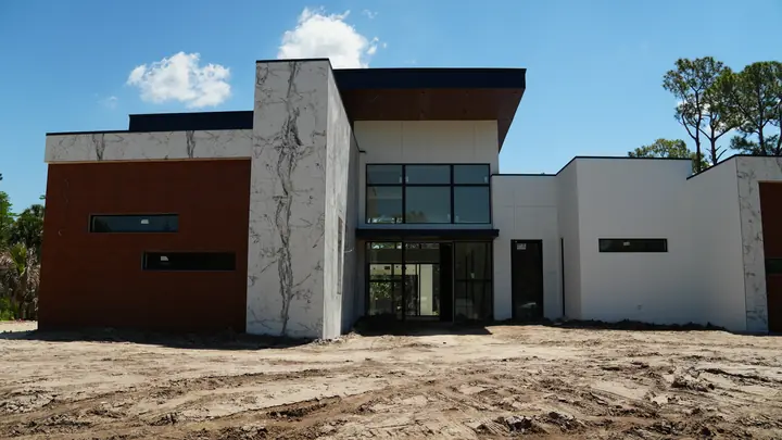 Front elevation of modern building with brick-look metal cladding