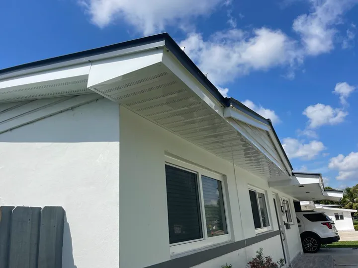 White aluminum soffit along a residential roofline