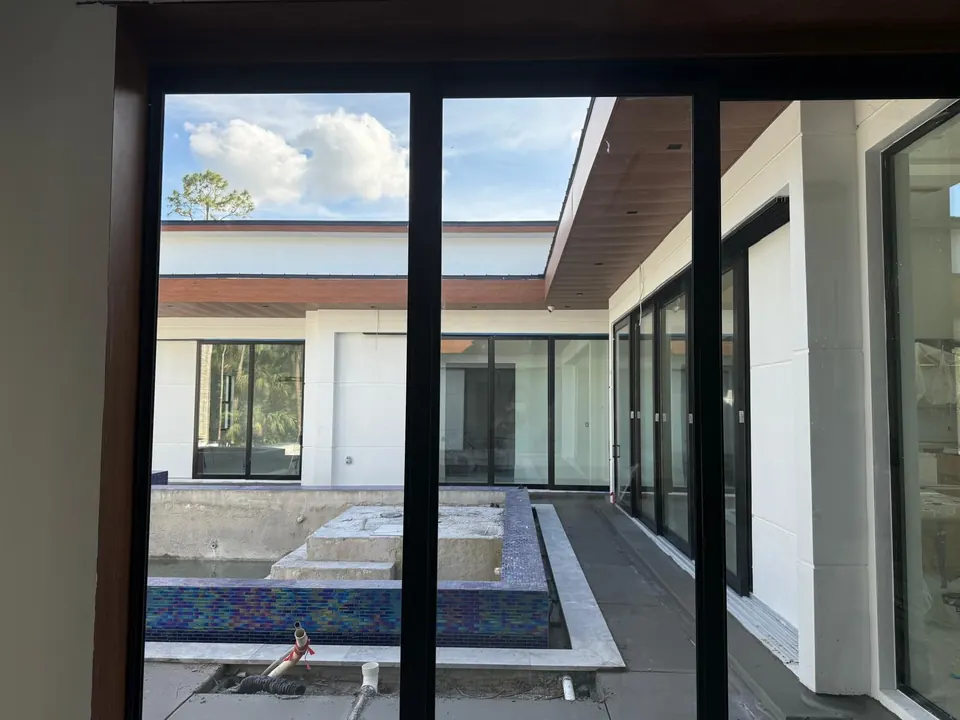 Courtyard glazing framed by metal soffit