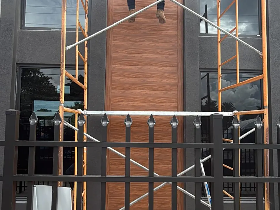 Architectural metal panels installed around tall windows